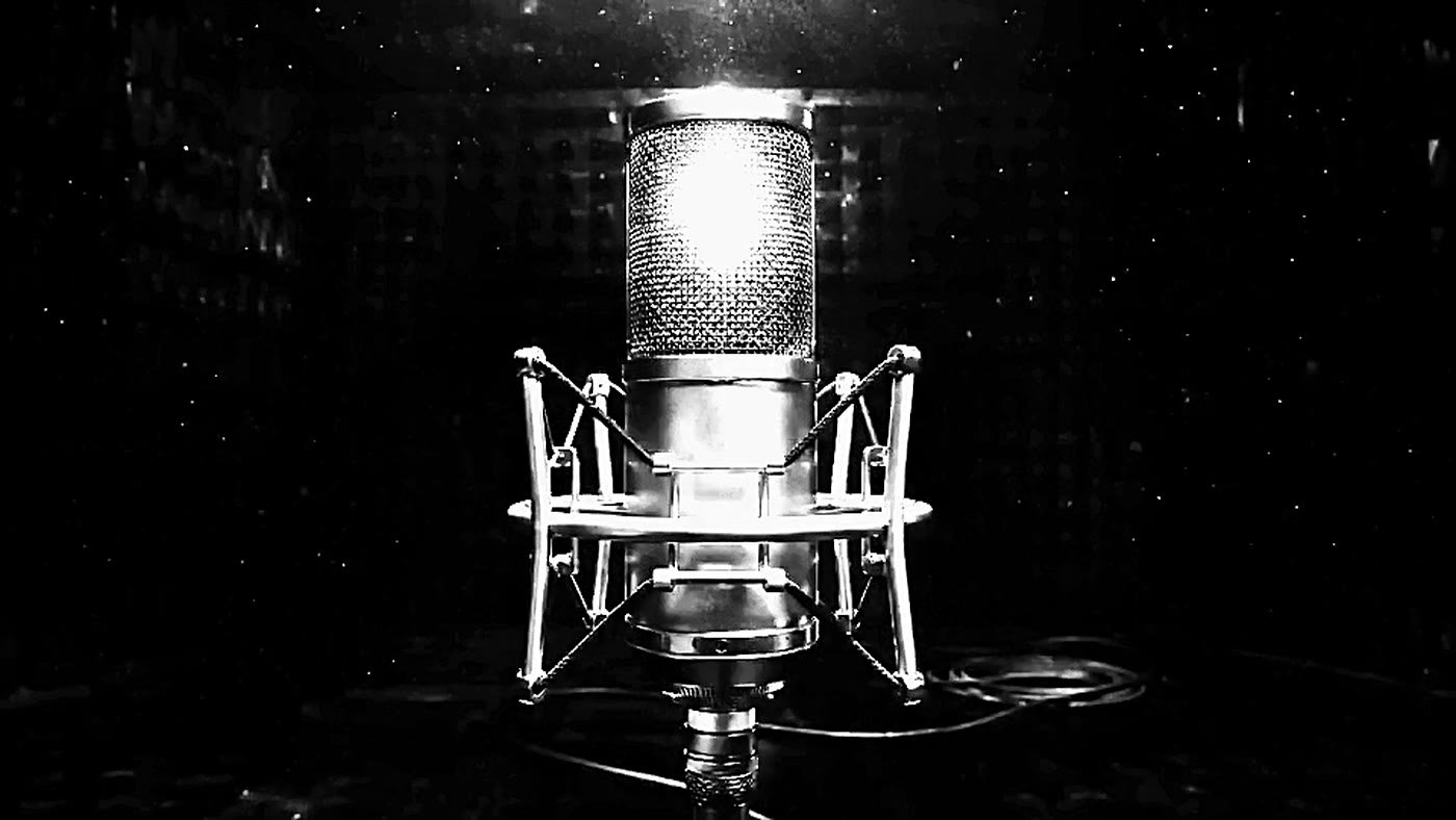 A large diaphragm microphone on a stand.